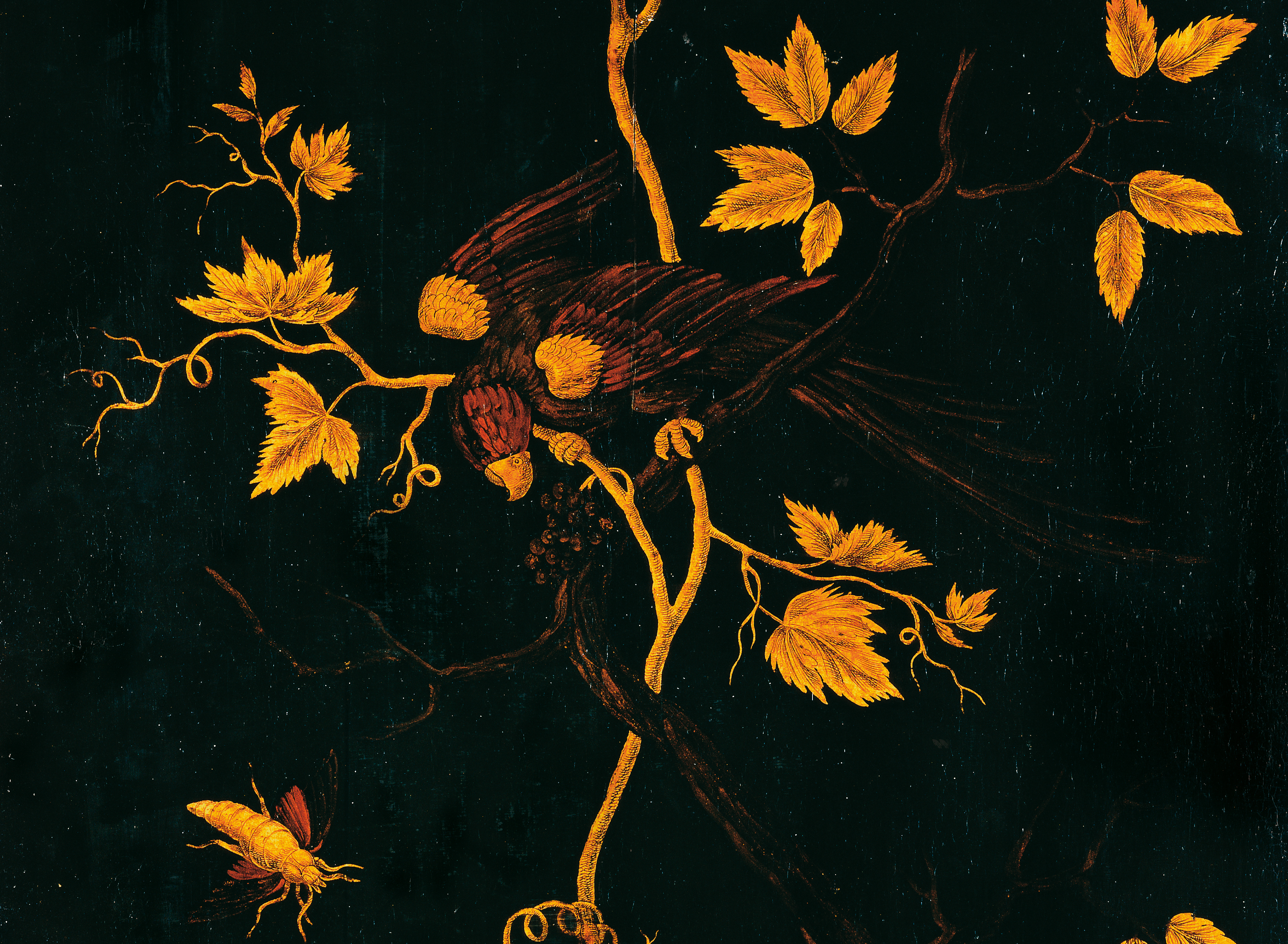 Ranken und Vogel aus goldenem Streulack und Blattgoldauflagen auf schwarzem Lackgrund.