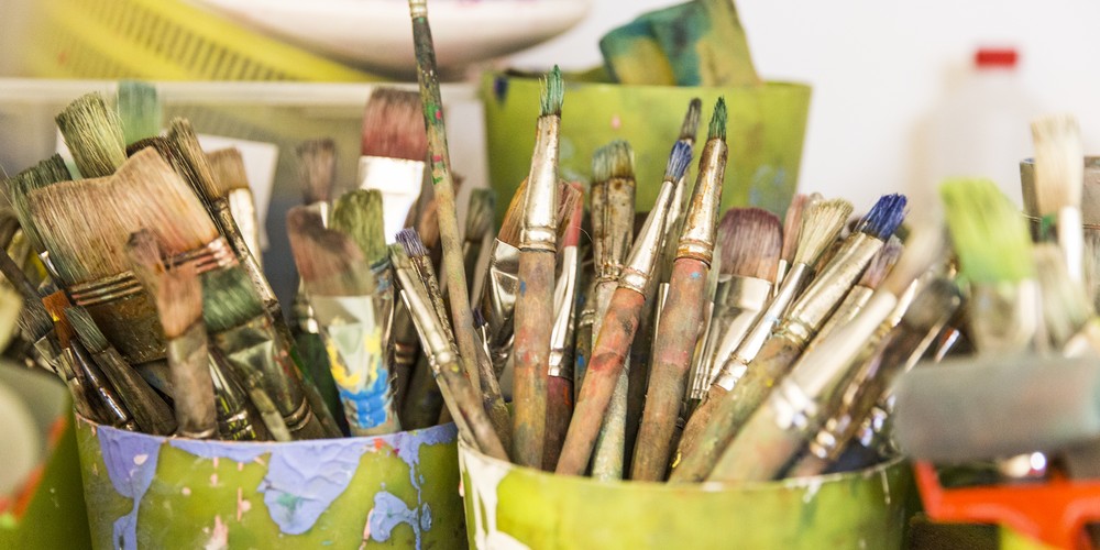 Paintbrushes in multiple Cups