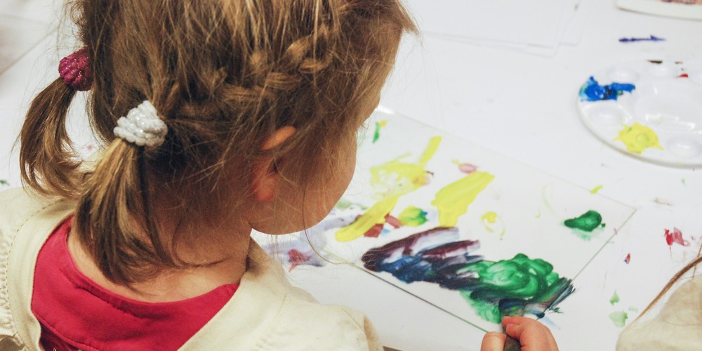 Girl infront of a painting