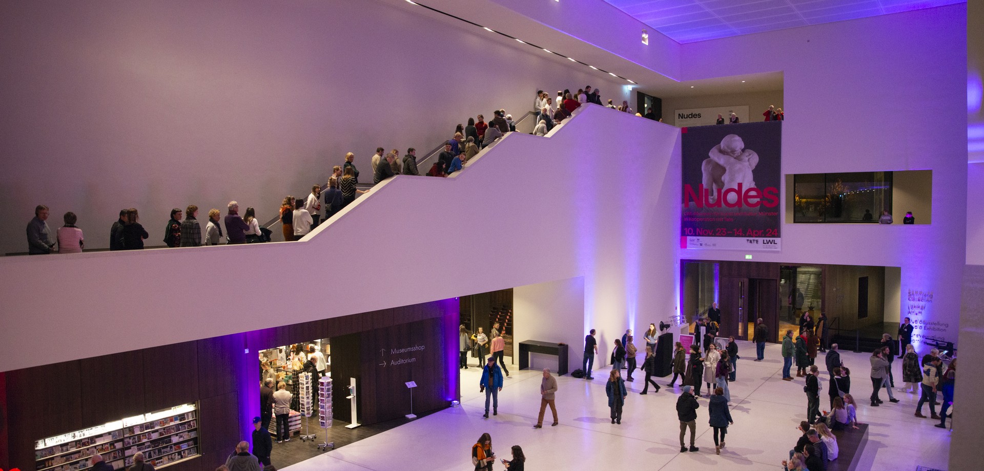 Interior view of the museum foyer in the evening, colourfully illuminated. Photo: LWL/Hanna Neander
