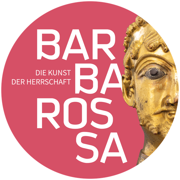 Das Bild zeigt einen goldenen Männerkopf mit dem Schriftzug "Barbarossa" vor einem vollflächigen, rosa Hintergrund.
