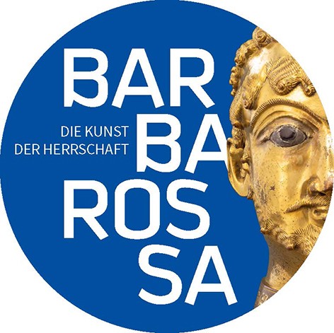 Das Bild zeigt die Hälfte eines goldenen Männerkopfes.