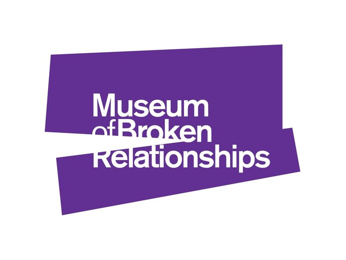 The logo of the “Museum of Broken Relationships.” White text on a broken purple block.