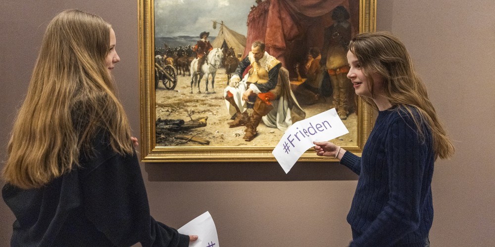 Two Girls infront of a Painting